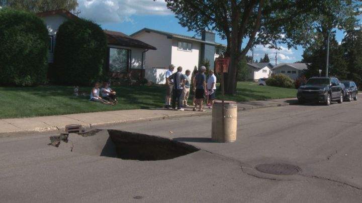 A large sinkhole opened up at 40 Avenue and 112A Street in south Edmonton on Aug. 4, 2016.