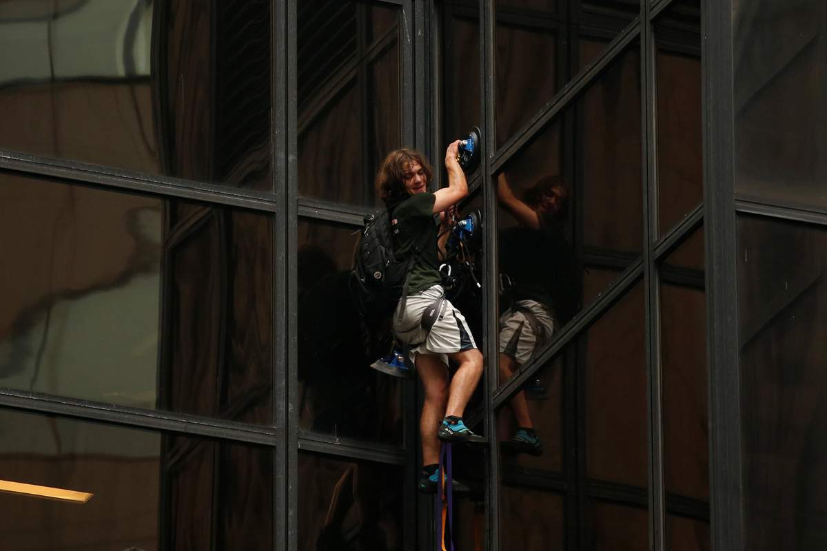 A man climbs the outside of Trump Tower in New York, U.S., August 10, 2016.