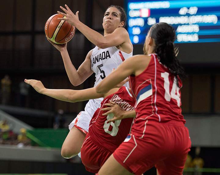 Canada’s Kia Nurse drives through Serbia’s Nevena Jovanovic and Ana Dabovic (14) on her way to the hoop during their preliminary round basketball match at the 2016 Summer Olympics Monday, August 8, 2016 in Rio de Janeiro, Brazil.