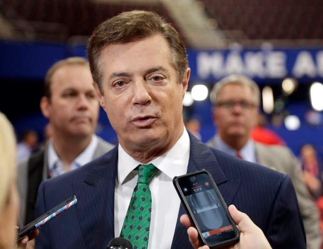 In this July 17, 2016 file photo, Trump Campaign Chairman Paul Manafort talks to reporters on the floor of the Republican National Convention at Quicken Loans Arena, Sunday, in Cleveland.