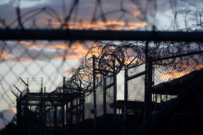 FILE - In this Nov. 21, 2013 file photo reviewed by the U.S. military, dawn arrives at the now closed Camp X-Ray, a detention facility at Guantanamo Bay Naval Base, Cuba.