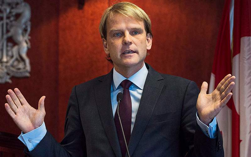 Former Minister of Citizenship and Immigration Chris Alexander speaks to the media about Canada's plan to provide faster help for Syrian and Iraqi Refugees wishing to come to Canada during a press conference in Toronto on Saturday, September 19, 2015.