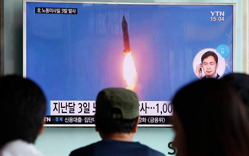 South Koreans watch a North Korean missile launch on September 5, 2016.