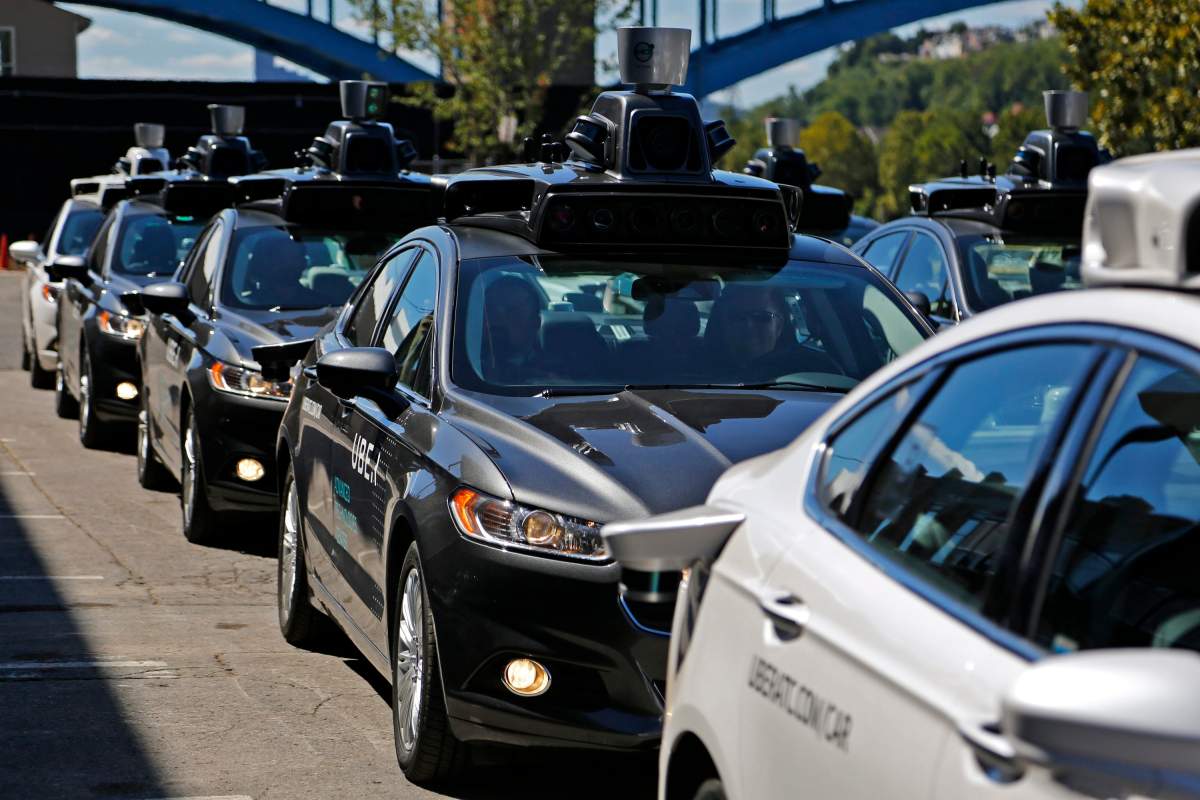 A group of self driving Uber vehicles position themselves to take journalists on rides during a media preview at Uber's Advanced Technologies Center in Pittsburgh, Monday, Sept. 12, 2016. Starting Wednesday morning, Sept. 14, 2016 dozens of self-driving Ford Fusions will pick up riders who opted into a test program with Uber. While the vehicles are loaded with features that allow them to navigate on their own, an Uber engineer will sit in the driverÄôs seat and seize control if things go awry. 