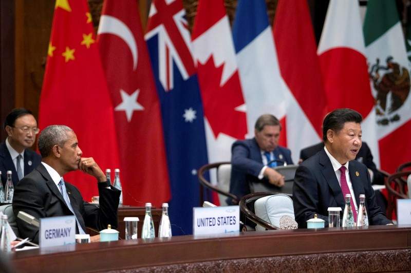U.S. President Barack Obama watches as Chinese President Xi Jinping speaks at the opening ceremony of the G20 Summit in Hangzhou, Zhejiang province, China September 4, 2016. 