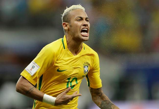 Brazil's Neymar celebrates scoring his side's 2nd goal against Colombia during a 2018 World Cup qualifying soccer match in Manaus, Brazil.