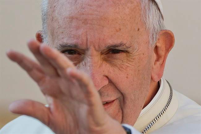 Pope Francis waves to the faithful as he arrives for his weekly general audience, in St. Peter's Square, at the Vatican, Wednesday, Sept. 28, 2016.