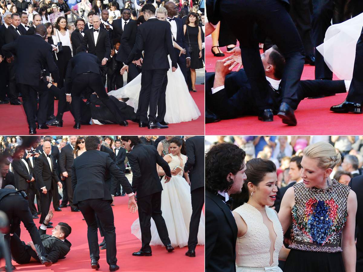 Vitalii Sediuk blocked by minders as he tries to slip under America Ferrera’s dress at the screening of the “How to train your Dragon 2” at the Cannes Film Festival. May 16, 2014