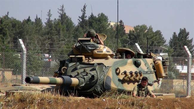 A Turkish army tank stationed near the Syrian border, in Suruc, Turkey, Saturday, Sept. 3, 2016. Turkey's state-run news agency says Turkish tanks have entered Syria's Cobanbey district northeast of Aleppo in a "new phase" of the Euphrates Shield operation. Turkish tanks crossed into Syria Saturday to support Syrian rebels against the Islamic State group, according to the Anadolu news agency.
