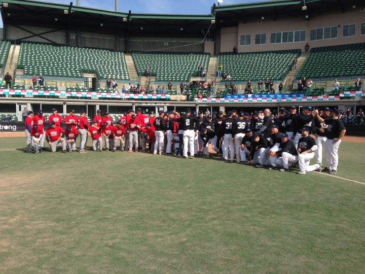 Dozens of ball players in Edmonton pose for a photo at the Edmonton Ball Park after playing a 72-hour game. Sept. 5, 2016.