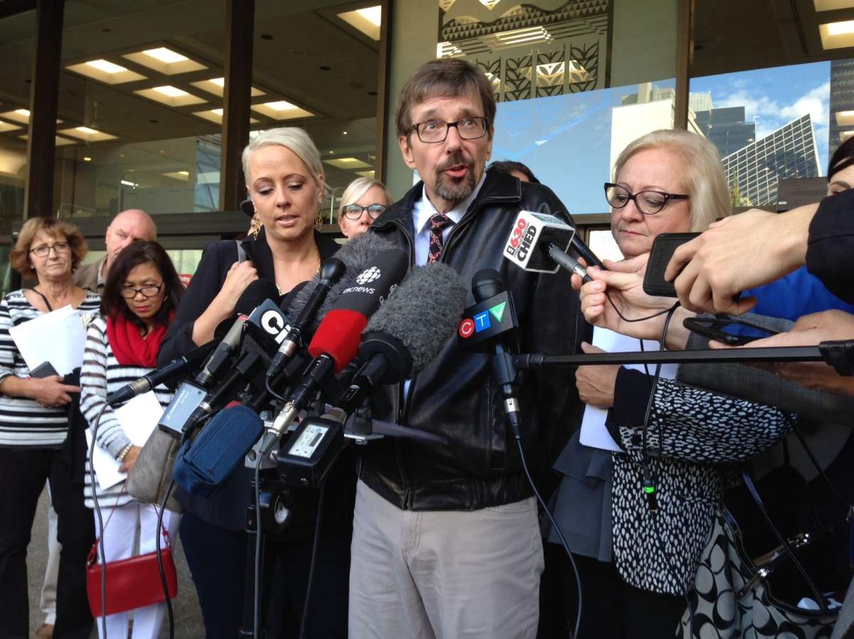 Bret McCann, surrounded by family, speaks to the media after Travis Vader is found guilty of second degree murder in the death of McCann's parents, St. Albert couple Lyle and Marie McCann. September 15, 2016.