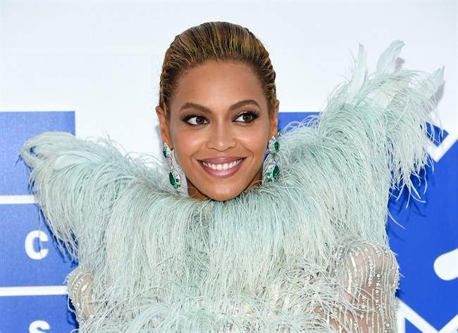 In this Sunday, Aug. 28, 2016 file photo, Beyonce Knowles arrives at the MTV Video Music Awards at Madison Square Garden, in New York. Even Beyonce needs to slow down every once in a while. Under doctor's orders for vocal rest, the superstar singer has postponed the Sept. 7, 2016, MetLife Stadium stop of her Formation World Tour until October 7, according to a statement Monday.