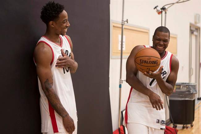 Toronto Raptors' DeMar DeRozan (left) and Kyle Lowry share a joke as they pose for a photoshoot during a media day for the team in Toronto on Monday September 26, 2016.