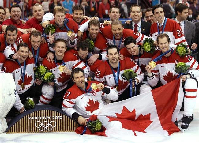 Team Canada posing for a photo after winning the gold medal game against the USA in the men's ice hockey gold medal final at the 2010 Winter Olympic Games in Vancouver, Sunday, Feb. 28, 2010.