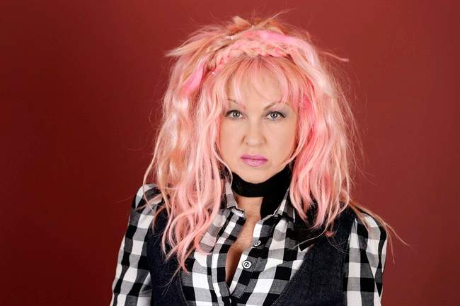In this March 14, 2016, photo, Cyndi Lauper poses in Nashville, Tenn., to promote her new country album, "Detour," releasing on Friday, May 6. Lauper has posted a message on her Facebook page voicing her opposition to Montreal's newly adopted breed-specific legislation. Thursday, Sept. 29, 2016.