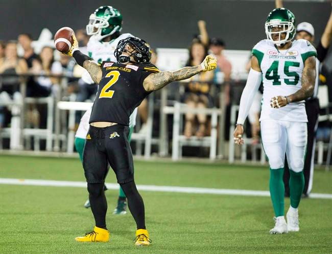 Hamilton Tiger-Cats slotback Chad Owens (2) celebrates a touchdown late in the first half of CFL football action against the Saskatchewan Roughriders in Hamilton on August 20, 2016. 