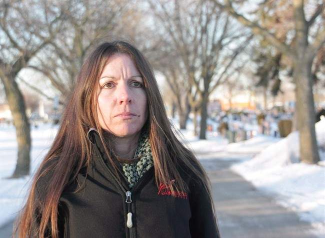 Denise Stark, mother of Cpl. Justin Stark, is seen at the cemetery where her son is buried in Hamilton, Ont., on Thursday, March 6, 2014. The mother of a Canadian soldier who killed himself after serving in Afghanistan will finally be honoured with a Memorial Cross this weekend, ending a long battle to have the military recognize his death as service related.