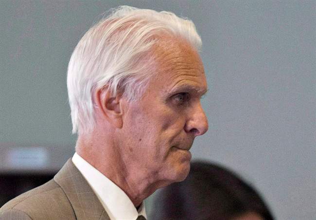 Former Quebec judge Jacques Delisle walks to court in Quebec City on June 14, 2012.