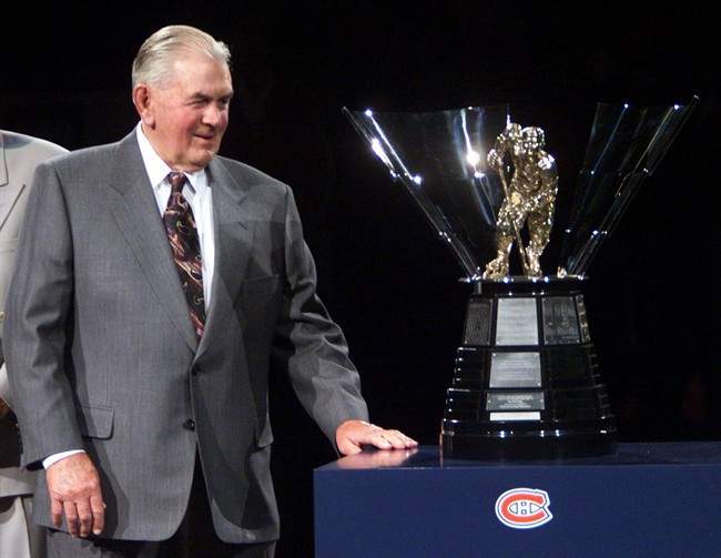 Former Montreal Canadiens superstar Maurice (Rocket) Richard unveils the new NHL scoring trophy named in his honour for the hometown fans before the team's game against the Buffalo Sabres in Montreal, Saturday, Feb.6, 1998. A Quebec member of the legislature wants her riding named after Richard. Marie Montpetit is expected to file a motion in the national assembly on Thursday to have the Montreal riding of Cremazie eventually bear Richard's name.