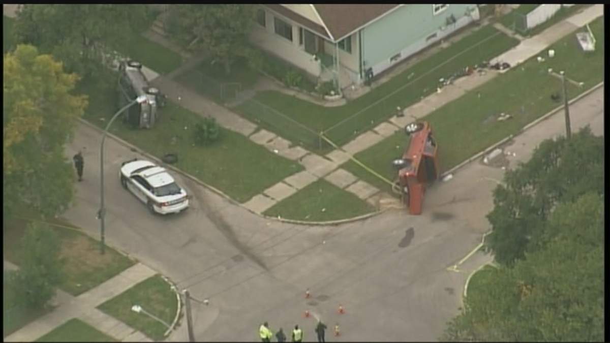 Two vehicles lie on their side after a crash in Winnipeg Tuesday afternoon.