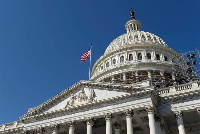An American flag flies over Capitol Hill in Washington.
