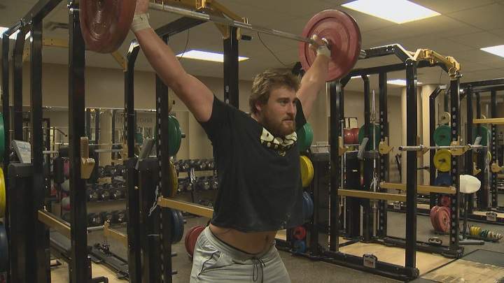Manitoba Bisons offensive lineman Geoff Gray trains inside the team's gym in September.