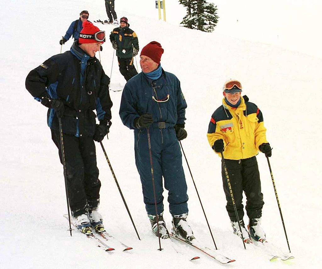Prince Charles (C) talks with Prince William (L) while Prince Harry looks on during the Royal tour's official photo opportunity in Whistler, Canada 26 March. The Royals leave for Great Britain 28 March.   AFP PHOTO/Kim STALLKNECHT    (Photo credit should read KIM STALLKNECHT/AFP/Getty Images).