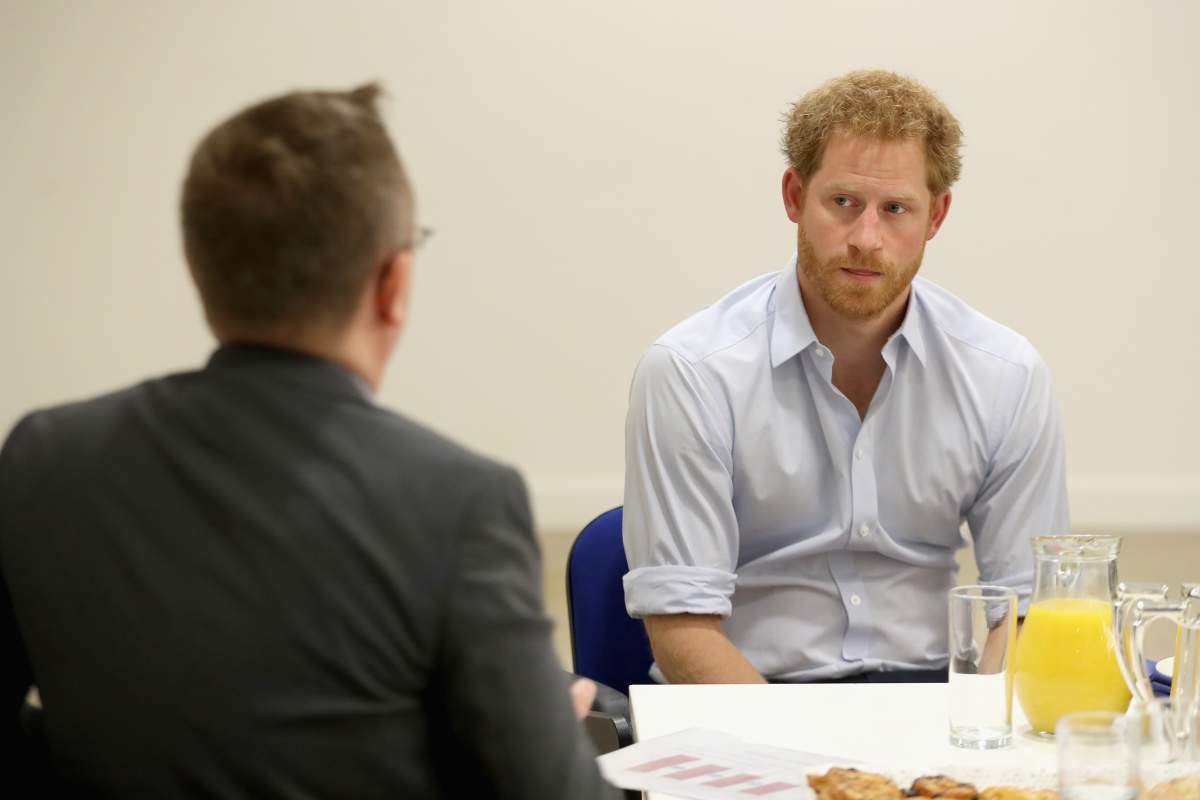 Prince Harry chats with staff as visits Burrell Street Sexual Health Clinic on July 14, 2016 in London, England. Prince Harry was visiting the clinic, run by Guy's and St Thomas NHS Foundation to promote the importance of getting tested for HIV and other STDs.