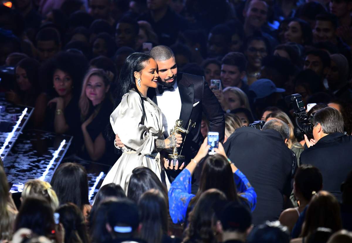 Drake escorts Rihanna after presenting her with The Video Vanguard Award during the 2016 MTV Video Music Awards at the Madison Square Garden in New York on August 28, 2016.