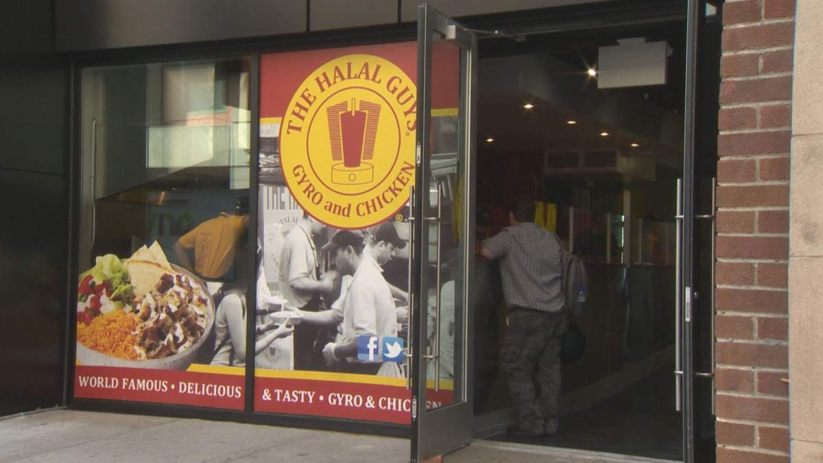 A customer stands in line at the Halal Guys restaurant in Montreal, Tuesday, September 6, 2016.