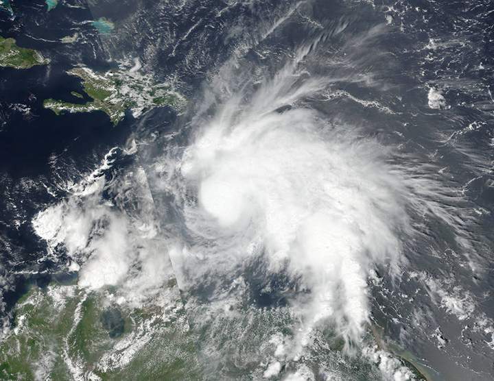  Hurricane Matthew grew into a powerful Category 3 storm on Friday as it crossed the Caribbean Sea on a course that could have it pounding Jamaica within days.