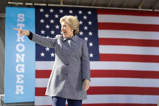 Democratic presidential candidate Hillary Clinton gestures as she takes the stage during a campaign stop in Des Moines, Thursday, Iowa, Sept. 29, 2016. 