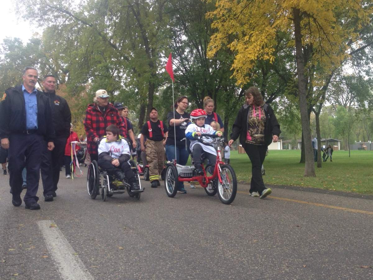 Timmy Shiels led the walk on his bike.