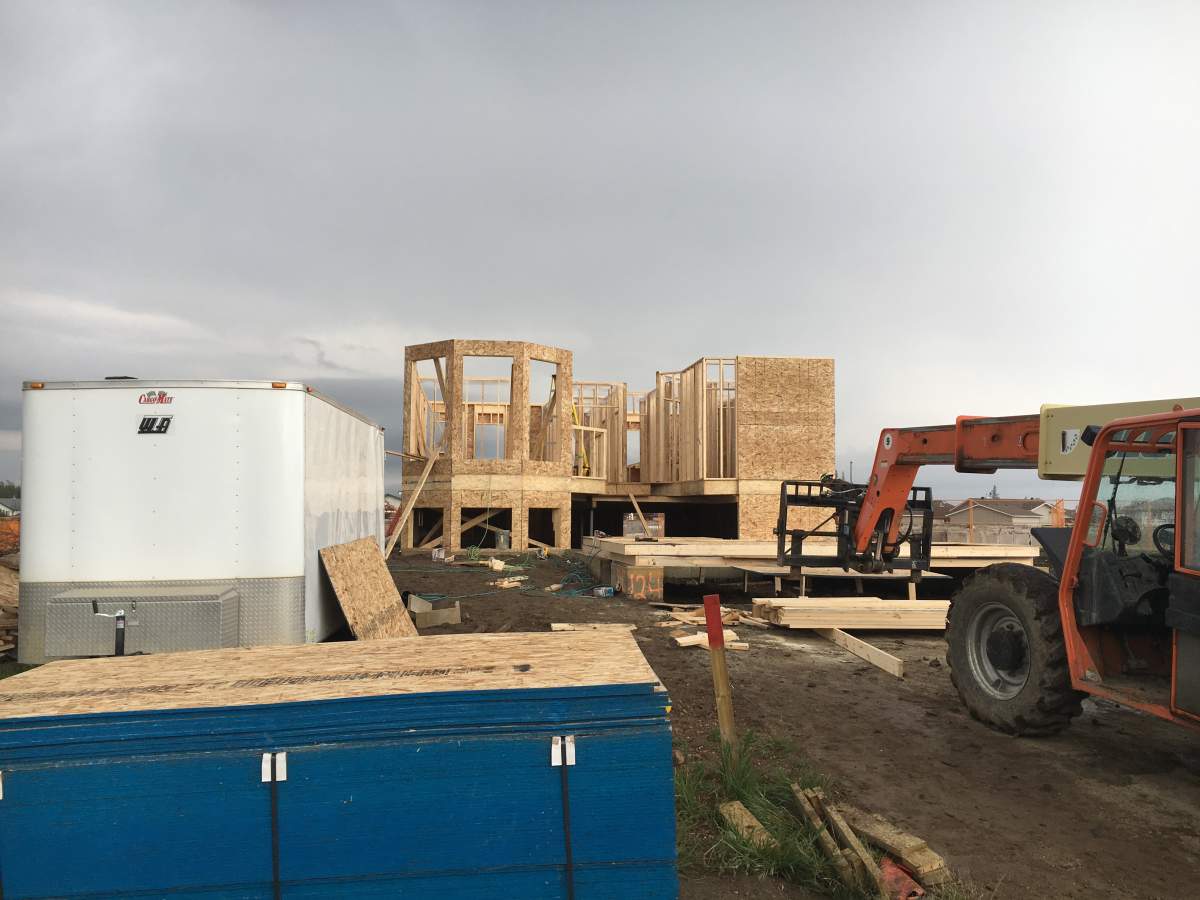 The first home to get a permit to be rebuilt in Fort McMurray sits framed. The contractor hopes it will be complete in December.