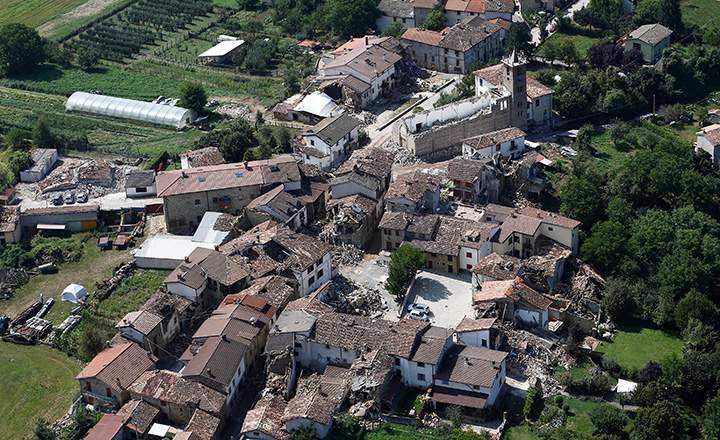 Collapsed houses and a church are seen in Villa San Lorenzo, a village near Amatrice after an earthquake hit central Italy, September 1, 2016.
