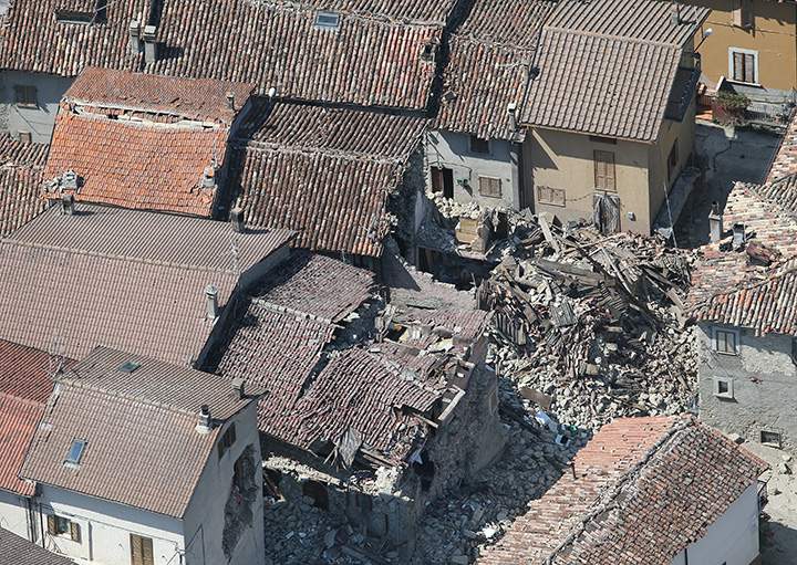 Collapsed houses are seen in a small village near Amatrice after an earthquake hit central Italy, September 1, 2016.