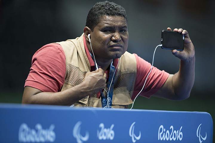 Blind Brazilian photographer Joao Maia takes pictures with his smartphone using the sound as a reference during the Rio 2016 Paralympic Games in Rio de Janeiro, Brazil on September 9, 2016. 