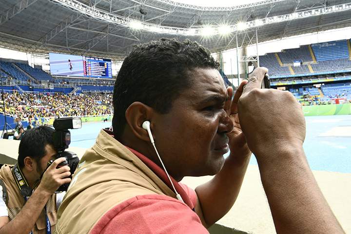 Blind Brazilian photographer Joao Maia takes pictures with his smartphone using the sound as a reference during the Rio 2016 Paralympic Games in Rio de Janeiro, Brazil on September 9, 2016.
