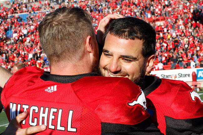 Calgary Stampeders' kicker Rene Paredes, right, celebrates with quarterback Bo Levi Mitchell after kicking a field goal to defeat the Winnipeg Blue Bombers on Saturday.