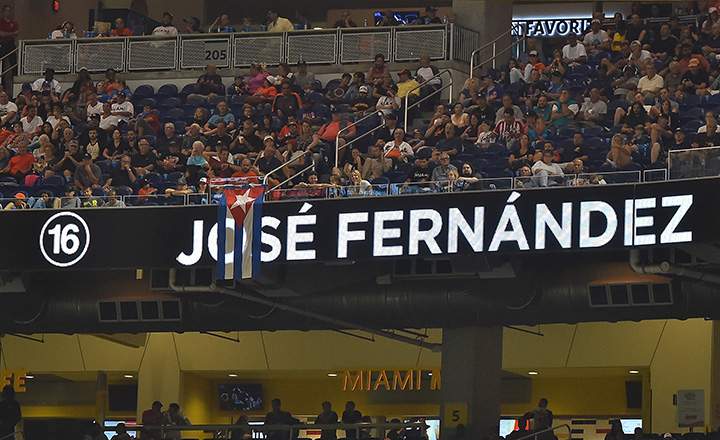A Cuban flag hangs over the video board honouring Miami Marlins starting pitcher Jose Fernandez at Marlins Park.