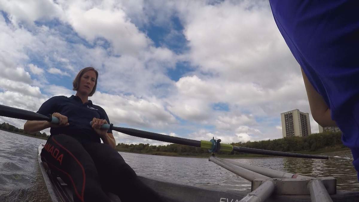 Olympic silver medallist Janine Stephens rowing in front of the Winnipeg Rowing Club.