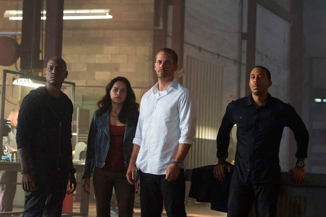 The photo provided by Universal Pictures shows, from left, Tyrese Gibson as Roman, Michelle Rodriguez as Letty, Paul Walker as Brian, and Chris "Ludacris" Bridges as Tej, in the film, "Furious 7," directed by James Wan. The appeal of the ‚ÄúFast and Furious‚Äù franchise, which released its seventh installment in 2015, has long been based on both high-octane races and a much varied cast.