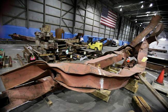 In this Wednesday, March 23, 2011 file photo, twisted beams and other remains from the attacks at the World Trade Center sit in Hangar 17 at New York's John F. Kennedy International Airport.