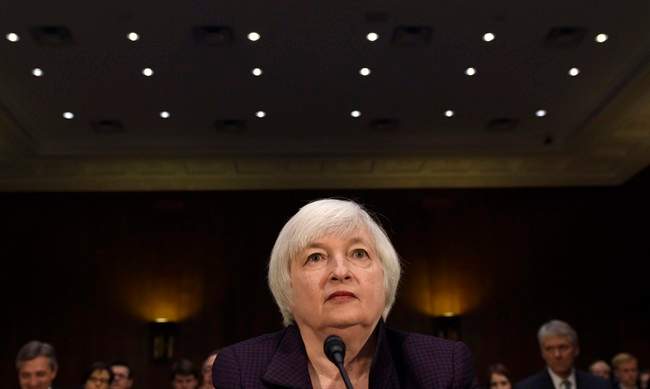 In this Tuesday, Feb. 24, 2015, file photo, Federal Reserve Board Chair Janet Yellen prepares to testify on Capitol Hill in Washington, before the Senate Banking Committee.