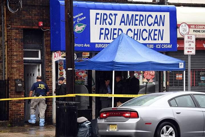 Investigators inside the family restaurant and adjoined apartment of Ahmad Khan Rahami in Elizabeth, New Jersey (JEWEL SAMAD/AFP/Getty Images)