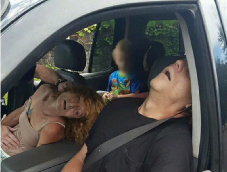 Ohio police have released a graphic photo of a couple overdosing on heroin with a four-year-old boy in the car.