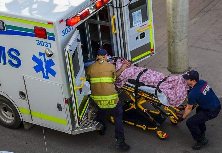 A person is loaded into an ambulance at Prairie Mall in Grande Prairie, Alta. on Sept. 15, 2016.