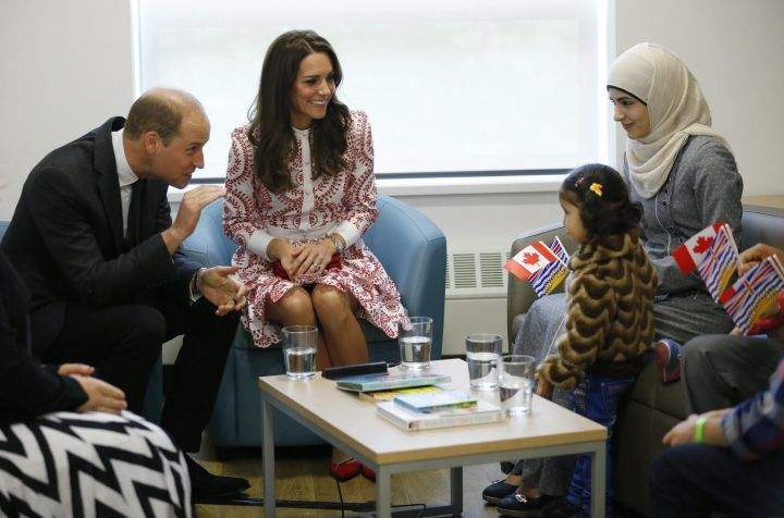 Britain’s Prince William, and Kate, Duchess of Cambridge meet with a family from Syria during a visit to the Immigrant Services Society in Vancouver, B.C., Sunday, Sept. 25, 2016.