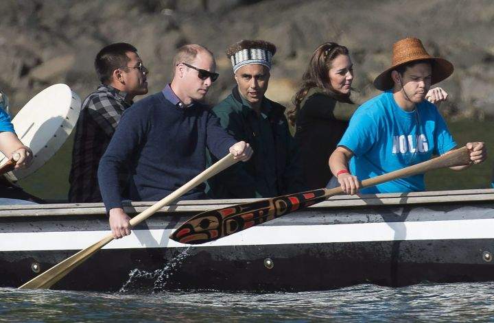 The Duke and Duchess of Cambridge paddle with a group in a traditional Haida canoe in the waters of Haida Gwaii, Friday, Sept. 30, 2016.