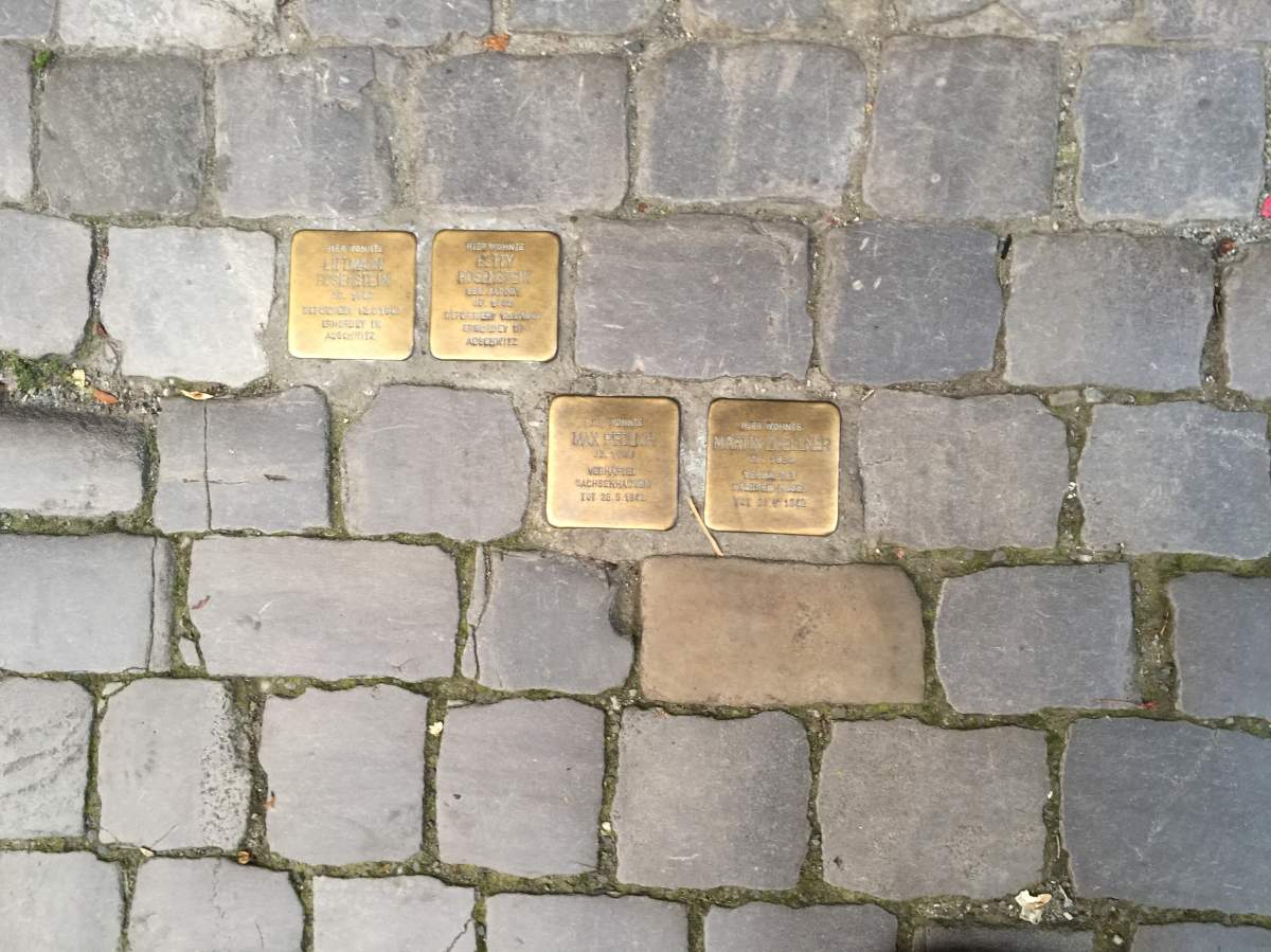 Stumbling stones on a Berlin street commemorating the last known address of families who perished in the Holocaust.